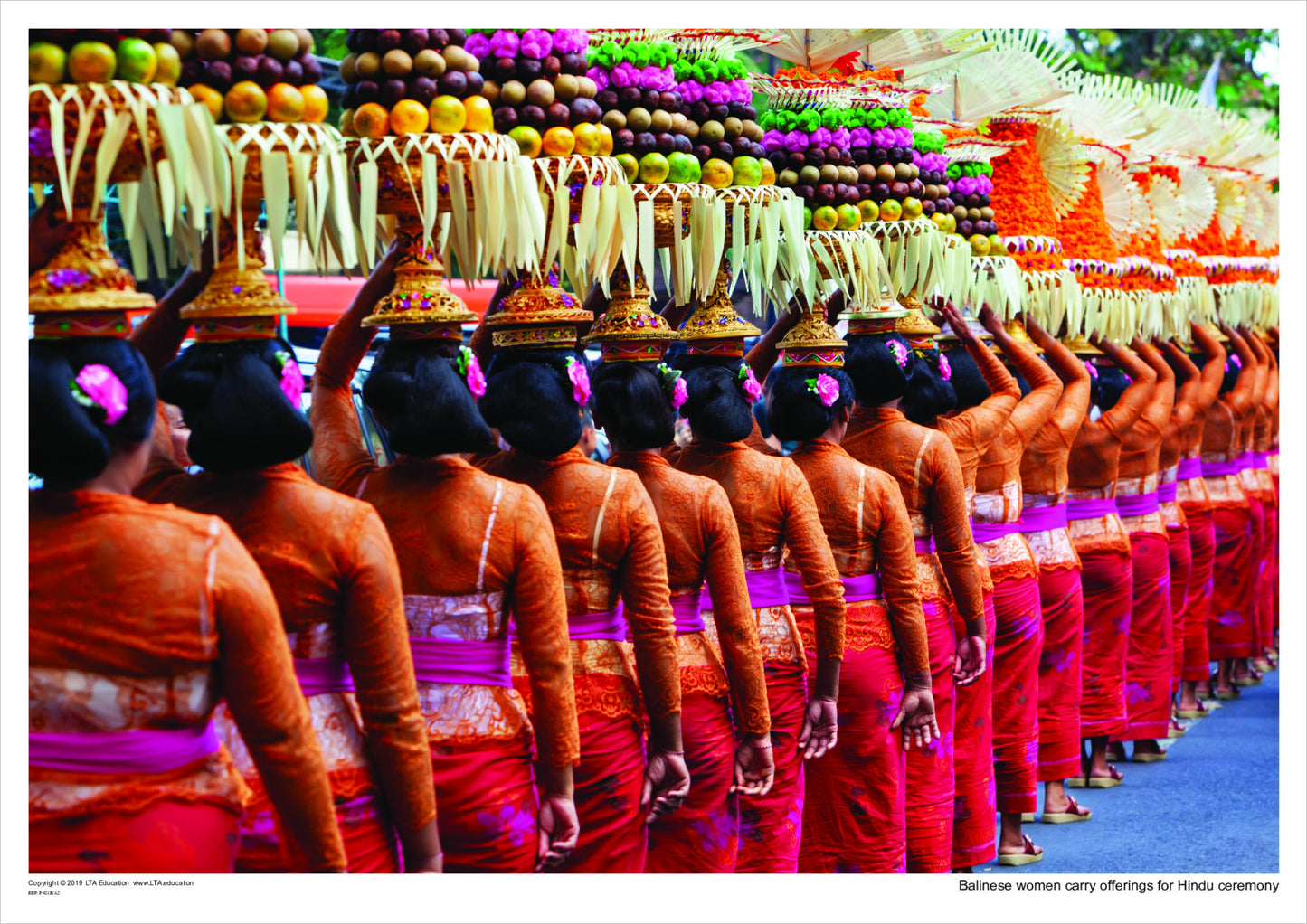 Balinese women carry offerings for Hindu ceremony