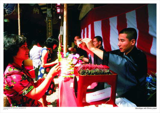 Worshipper with Shinto priest
